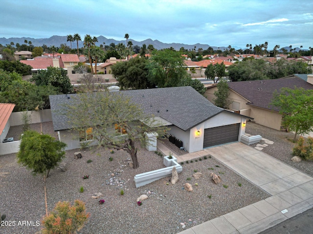 drone / aerial view featuring a mountain view