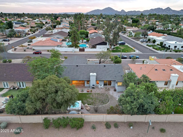 drone / aerial view featuring a residential view and a mountain view