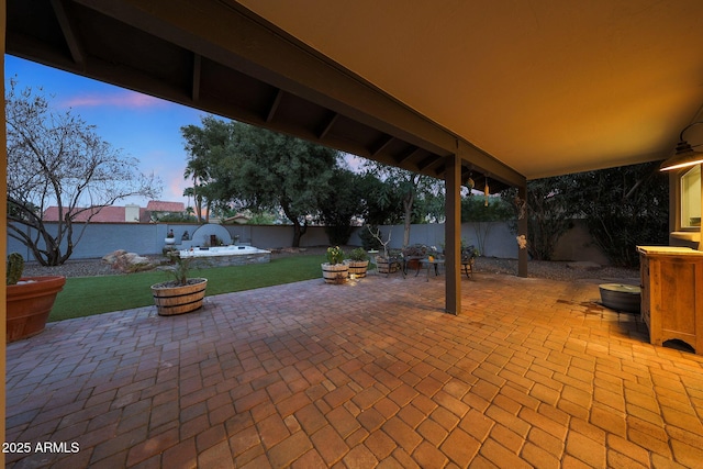 view of patio / terrace with an outdoor fire pit and a fenced backyard