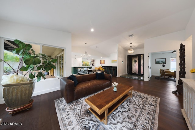 living area featuring recessed lighting, visible vents, vaulted ceiling, dark wood-style floors, and an inviting chandelier