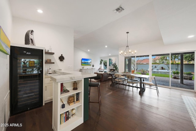 kitchen featuring wine cooler, open shelves, and dark wood-style flooring