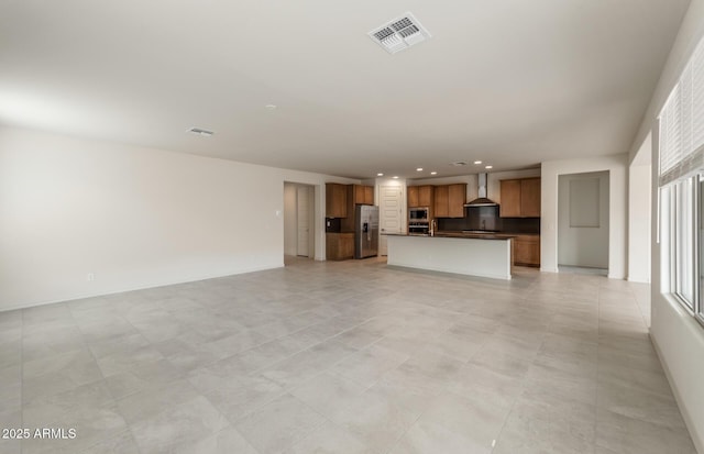 unfurnished living room with light tile patterned floors