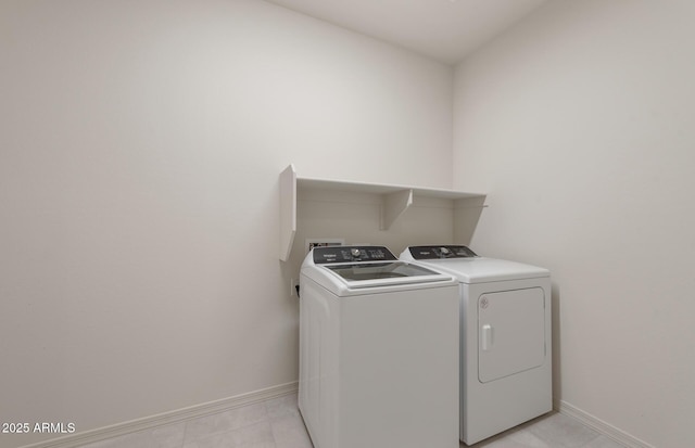 laundry room featuring washing machine and clothes dryer