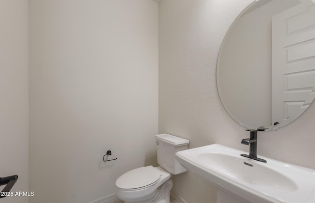 bathroom with sink and toilet