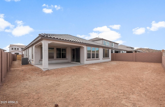 back of property featuring a patio and cooling unit