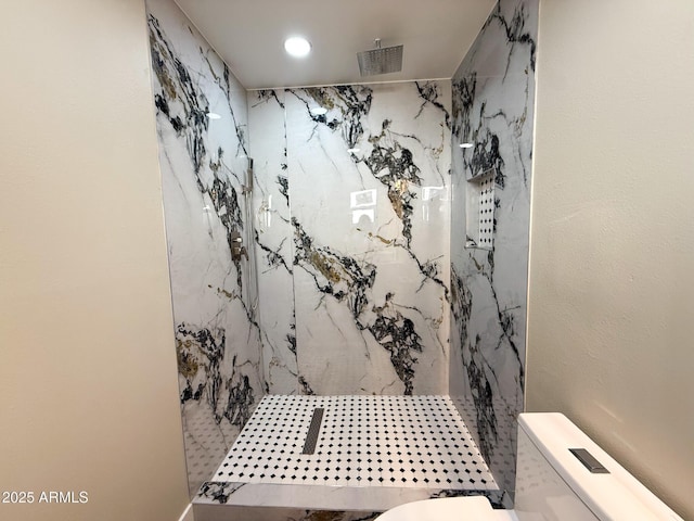 bathroom with toilet, visible vents, and a marble finish shower