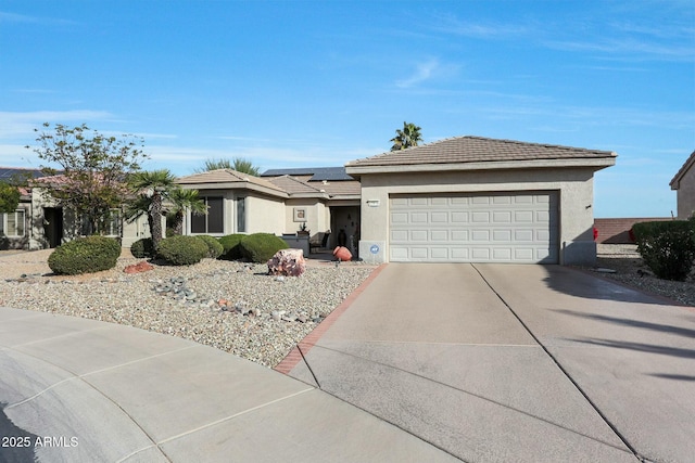 single story home featuring a garage and solar panels