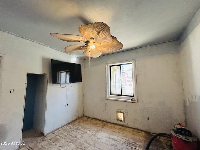 empty room featuring light hardwood / wood-style flooring and ceiling fan