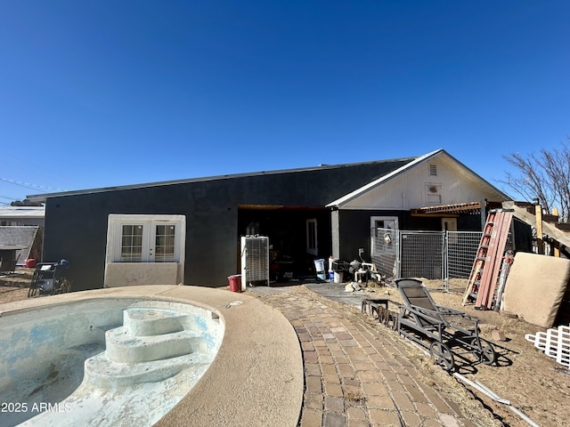 view of front of property featuring french doors and a patio area