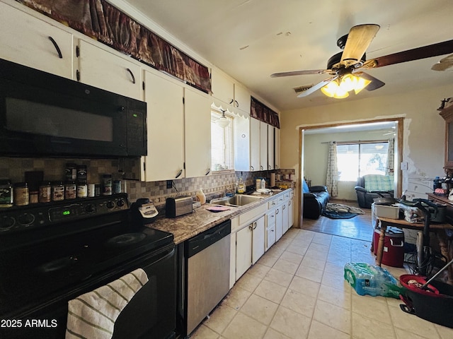 kitchen with light tile patterned flooring, tasteful backsplash, white cabinetry, ceiling fan, and black appliances