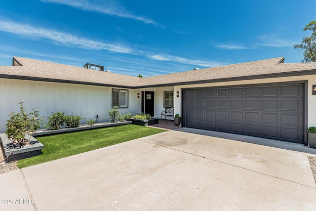11215 N 38th Ave N, Phoenix, AZ 85029 - single story home with concrete driveway, an attached garage, a front yard, and a shingled roof