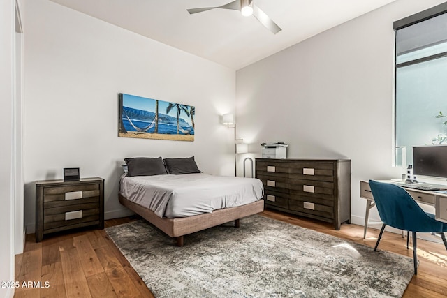 3131 N Central Ave Unit 7004, Phoenix, AZ 85012 - bedroom featuring hardwood / wood-style floors, a desk, lofted ceiling, and a ceiling fan
