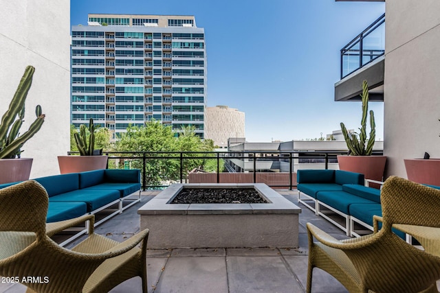 3131 N Central Ave Unit 7004, Phoenix, AZ 85012 - view of patio featuring an outdoor living space with a fire pit