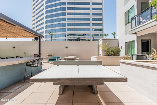 3131 N Central Ave Unit 7004, Phoenix, AZ 85012 - view of patio / terrace featuring exterior bar and outdoor dining space