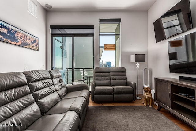 3131 N Central Ave Unit 7004, Phoenix, AZ 85012 - living area featuring wood finished floors and plenty of natural light