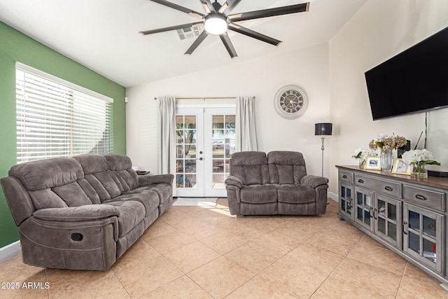 living room with vaulted ceiling, french doors, a healthy amount of sunlight, and light tile patterned flooring