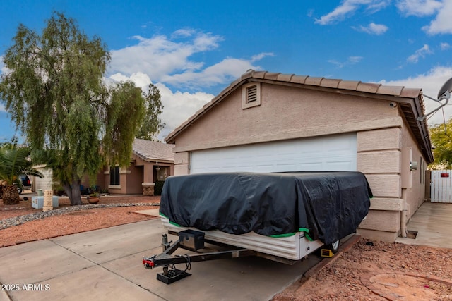 view of side of home with a garage