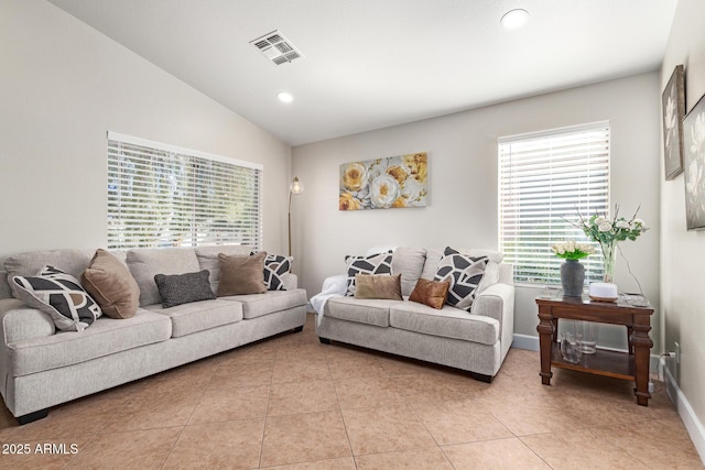 tiled living room with lofted ceiling