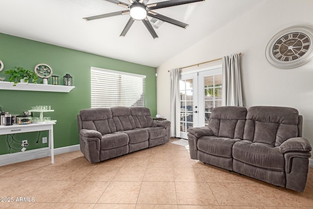 living room with french doors, ceiling fan, lofted ceiling, and light tile patterned floors