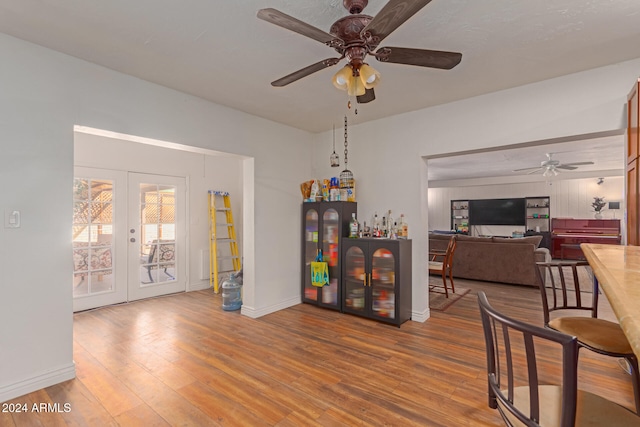 interior space featuring french doors, hardwood / wood-style flooring, and ceiling fan