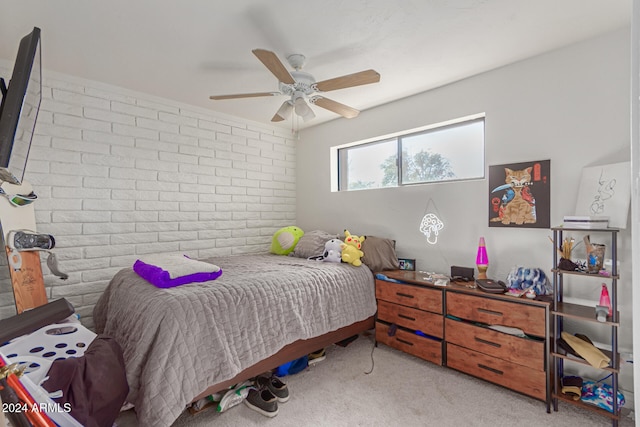 bedroom with light carpet, brick wall, and ceiling fan