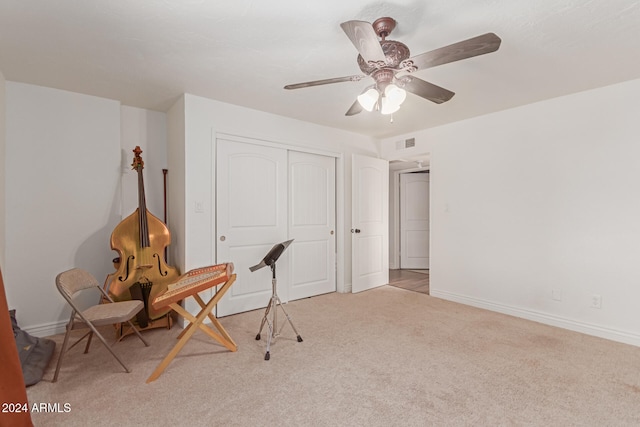 unfurnished office with light colored carpet and ceiling fan