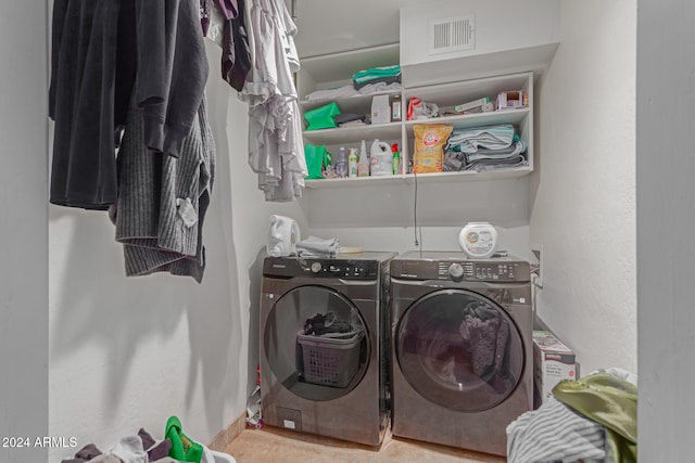 laundry area with independent washer and dryer