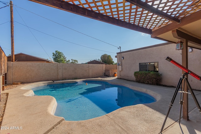 view of swimming pool featuring a pergola and a patio