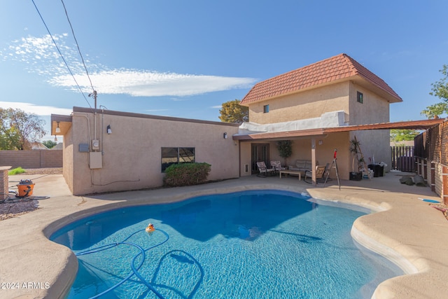 view of swimming pool with a patio area