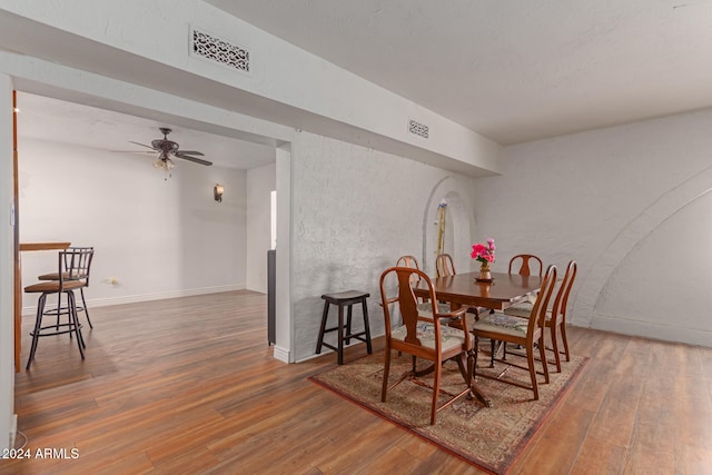 dining room featuring dark hardwood / wood-style floors and ceiling fan