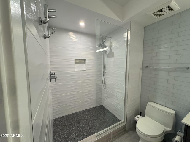 7120 E Kierland Blvd Unit 404, Scottsdale, AZ 85254 - bathroom featuring tiled shower, vanity, and recessed lighting