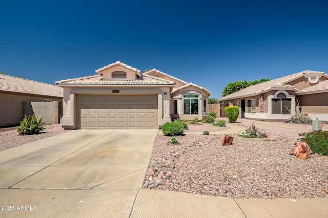 15558 N Ulrich Way, Surprise, AZ 85374 - mediterranean / spanish-style home with driveway, stucco siding, a tiled roof, a garage, and fence