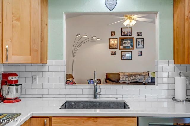 15558 N Ulrich Way, Surprise, AZ 85374 - kitchen with a sink, ceiling fan, backsplash, and light countertops
