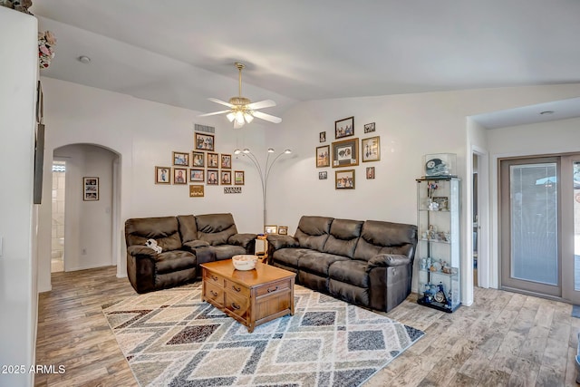 15558 N Ulrich Way, Surprise, AZ 85374 - living room with arched walkways, light wood-style floors, lofted ceiling, and ceiling fan