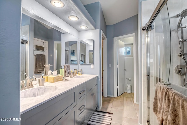 15558 N Ulrich Way, Surprise, AZ 85374 - full bath featuring a shower stall, double vanity, and tile patterned flooring