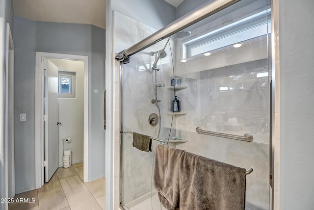15558 N Ulrich Way, Surprise, AZ 85374 - full bath with a stall shower, tile patterned floors, and baseboards