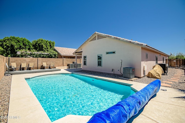 15558 N Ulrich Way, Surprise, AZ 85374 - view of swimming pool with cooling unit, a fenced backyard, and a patio