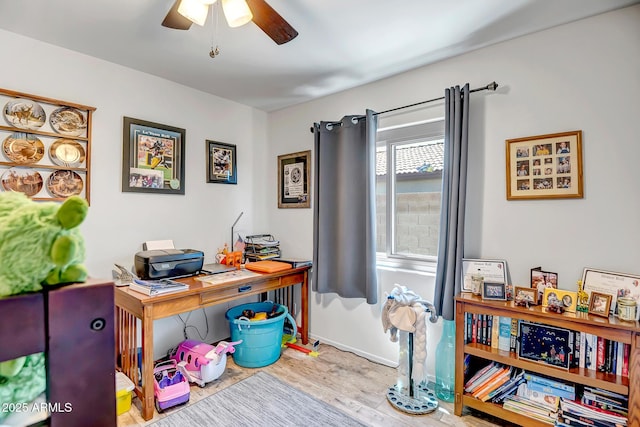 15558 N Ulrich Way, Surprise, AZ 85374 - home office featuring ceiling fan, wood finished floors, and baseboards