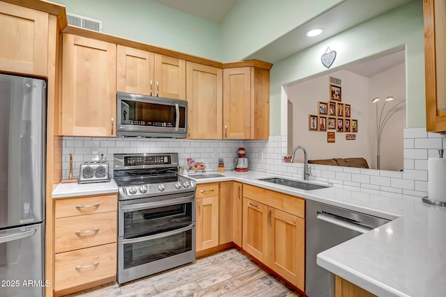 15558 N Ulrich Way, Surprise, AZ 85374 - kitchen with appliances with stainless steel finishes, a sink, light brown cabinets, and recessed lighting