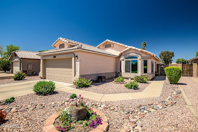 15558 N Ulrich Way, Surprise, AZ 85374 - view of front of property featuring a tile roof, fence, an attached garage, stucco siding, and driveway