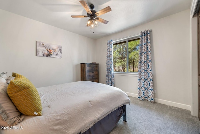 carpeted bedroom featuring a ceiling fan and baseboards