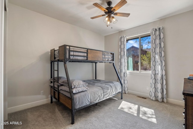 bedroom featuring visible vents, ceiling fan, carpet, and baseboards