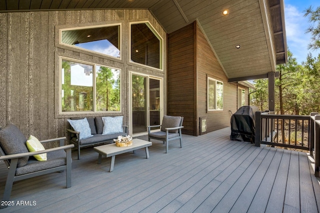 deck featuring an outdoor living space and area for grilling
