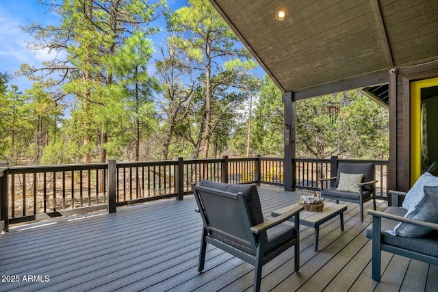 wooden terrace with outdoor lounge area
