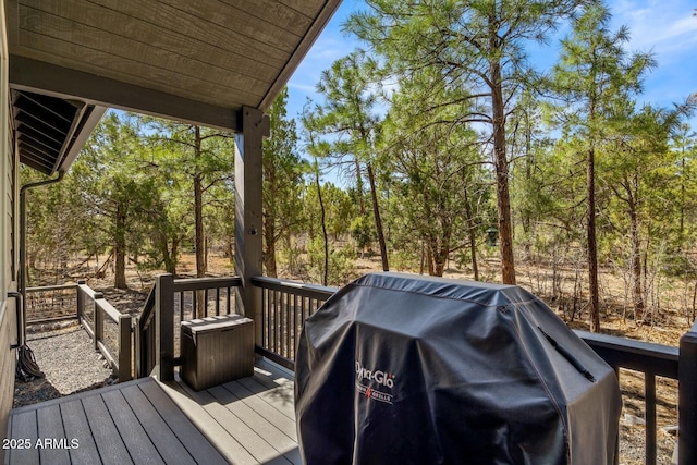 wooden deck featuring area for grilling