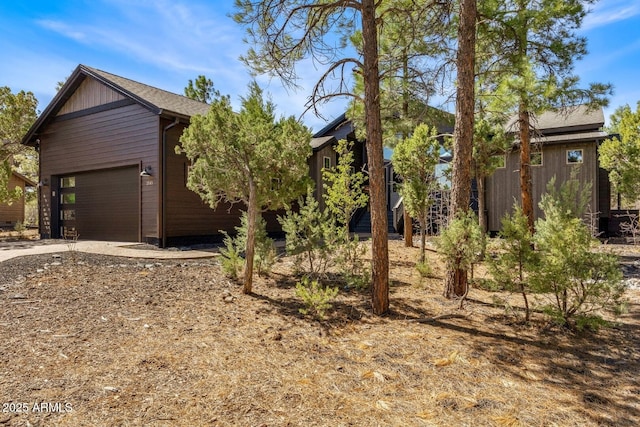 view of front of property with driveway and a garage