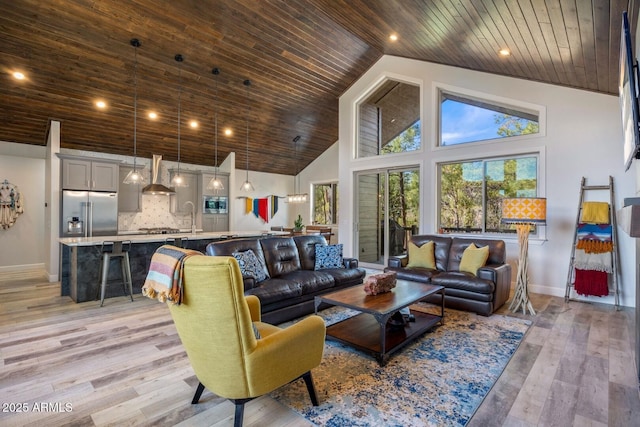 living room featuring wooden ceiling, high vaulted ceiling, light wood finished floors, and baseboards