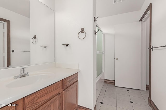 bathroom with vanity, tile patterned floors, and shower / bath combination with glass door