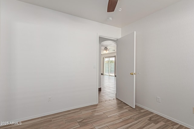 unfurnished room with ceiling fan