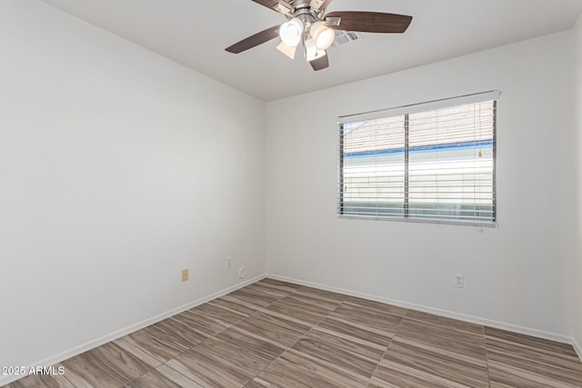 spare room with ceiling fan